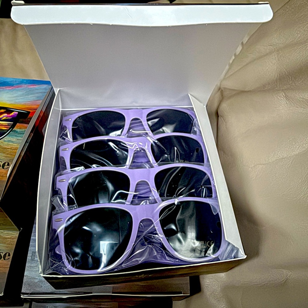 84 purple sunglasses. Purchased for wedding. These are unused leftovers!